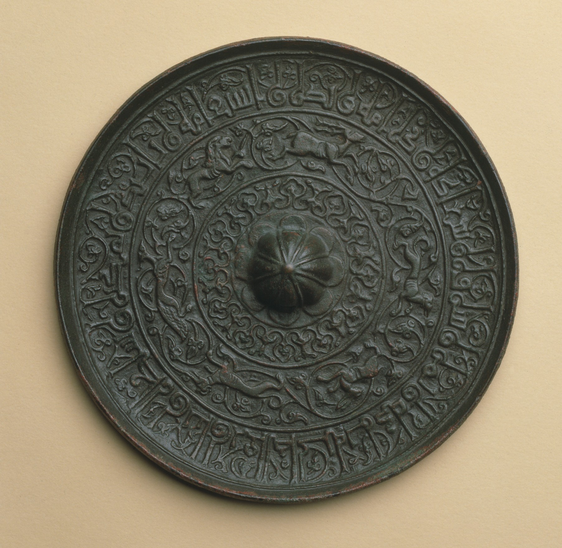 The decorated reverse of a circular cast bronze mirror from twelfth-century Iran